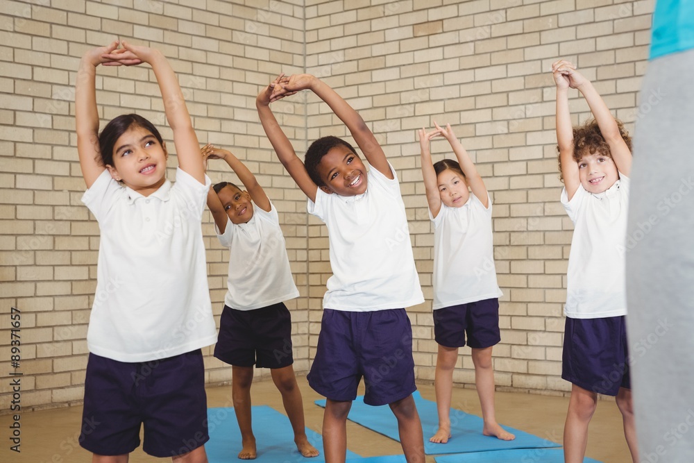 Fototapeta premium Happy students stretching out together