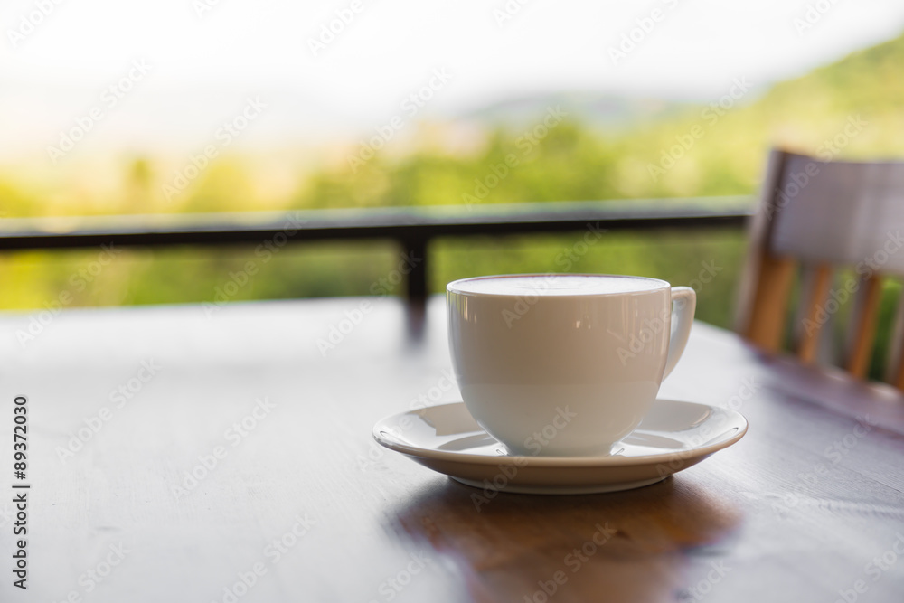 Coffee in white cup on wood table Coffee in white cup on wood table