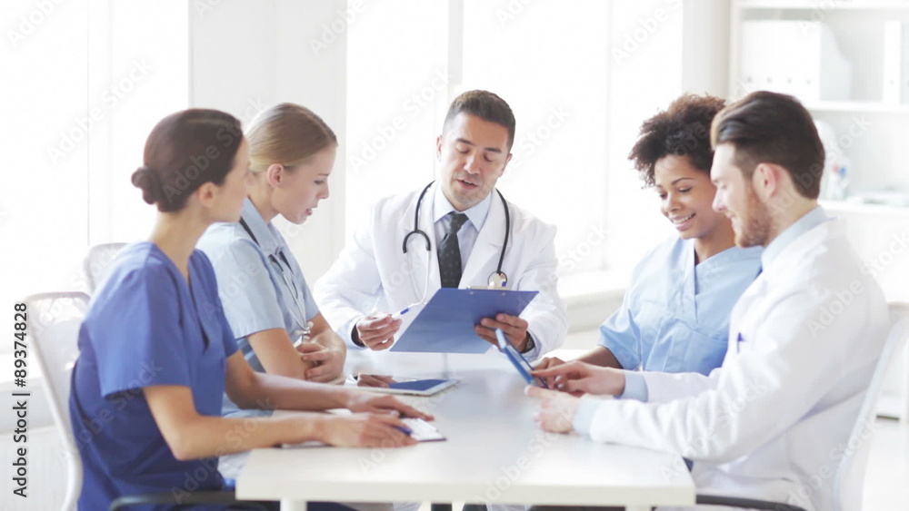 group of happy doctors meeting at hospital office group of happy doctors meeting at hospital office