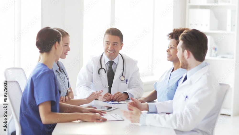 group of happy doctors meeting at hospital office group of happy doctors meeting at hospital office