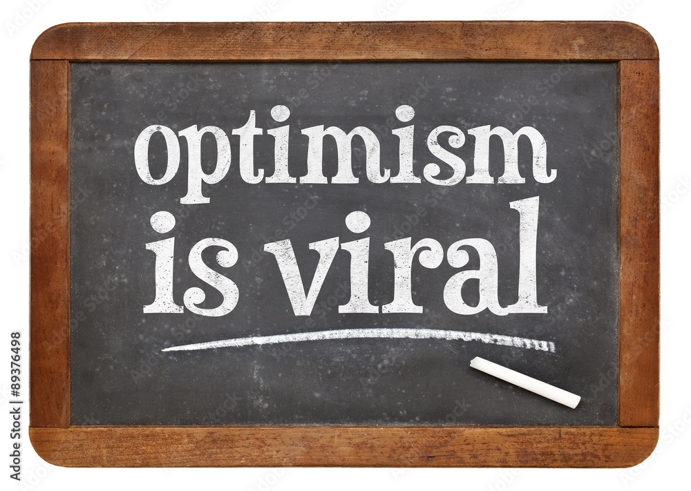 Fototapeta premium optimism is viral - text on blackboard