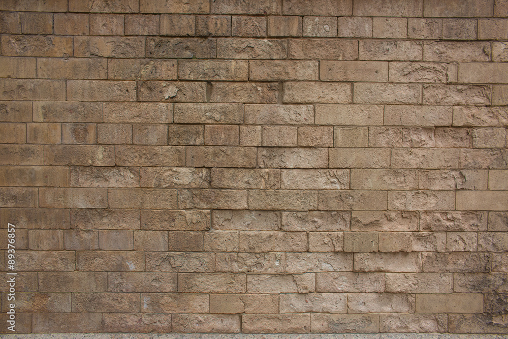 Obraz premium Hintergrund gelbe Backsteinwand mit Fehlstellen