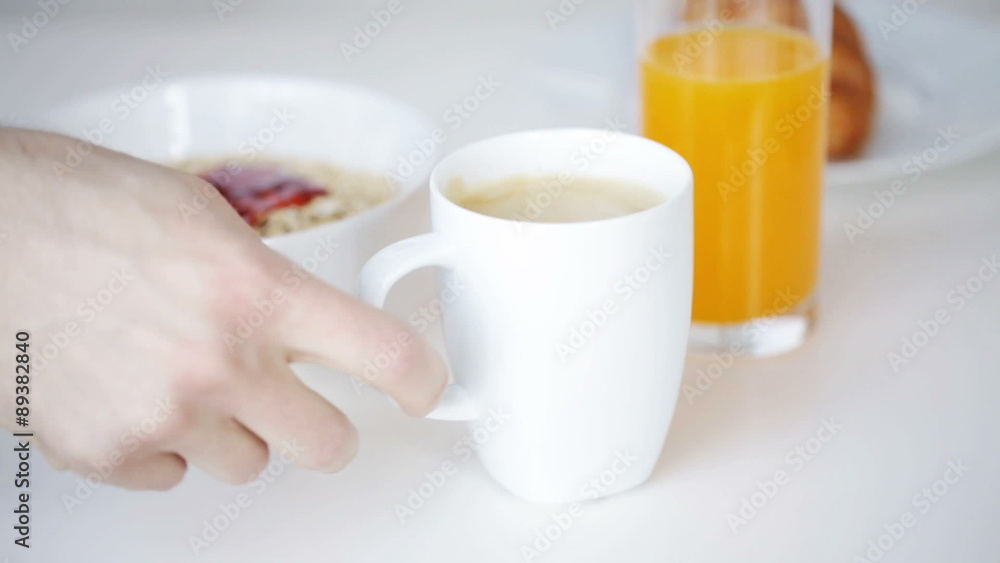 close up of man with newspaper having breakfast close up of man with newspaper having breakfast