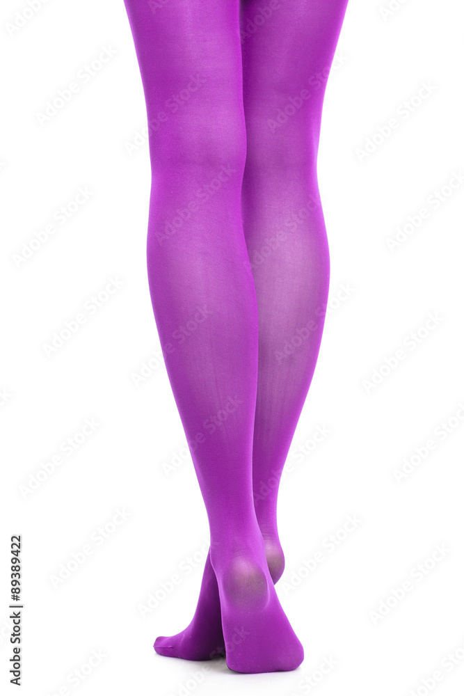 Woman slim legs and violet stockings isolated Woman slim legs and violet stockings isolated