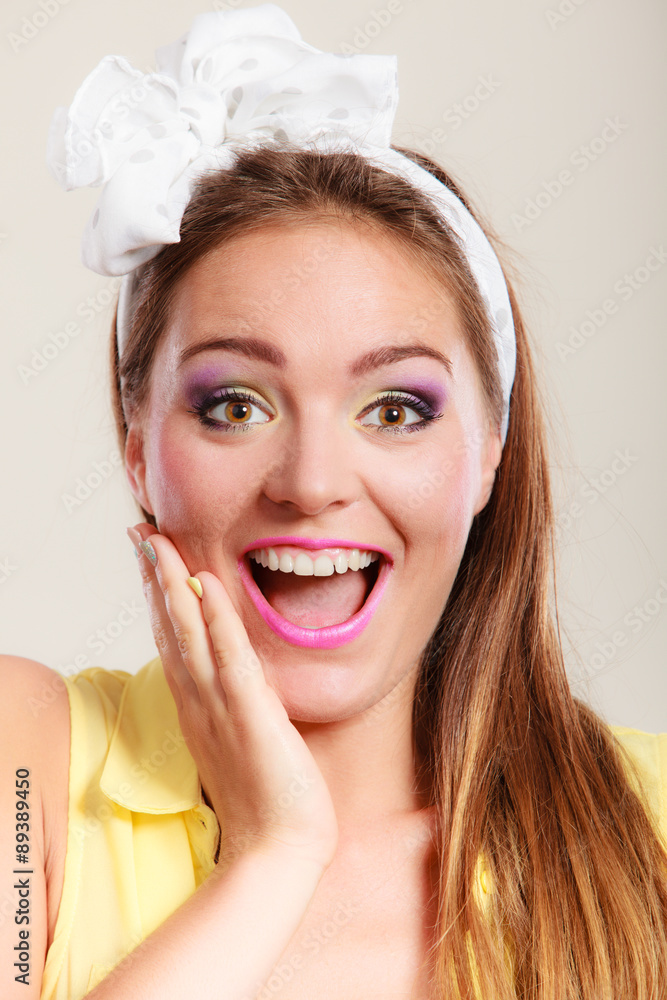 Portrait of happy pretty pin up girl with bow. Portrait of happy pretty pin up girl with bow.