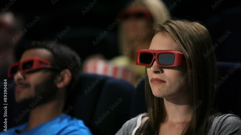 Group of friends watching film in cinema Group of friends watching film in cinema