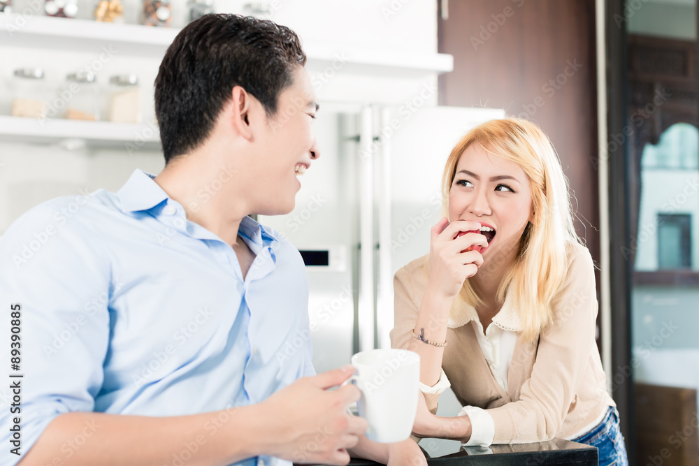 Fototapeta premium Asian couple having breakfast together