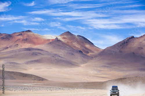 Off-road vehicle driving in the Atacama desert, Bolivia photo