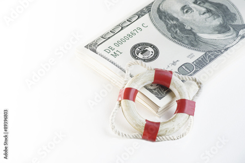 Financial security concept image.  Life buoy and cash photo