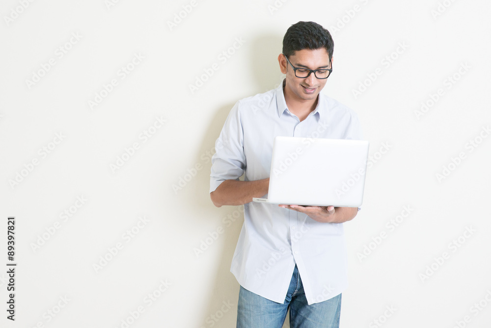 Casual business Indian man using laptop Casual business Indian man using laptop