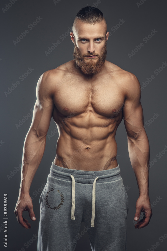 Fototapeta premium Portrait of muscular shirtless man with beard.
