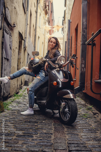 Casual female on moto scooter © Fxquadro