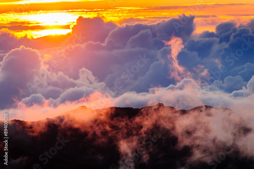 Clouds at sunrise over Haleakala Crater, Maui, Hawaii, USA