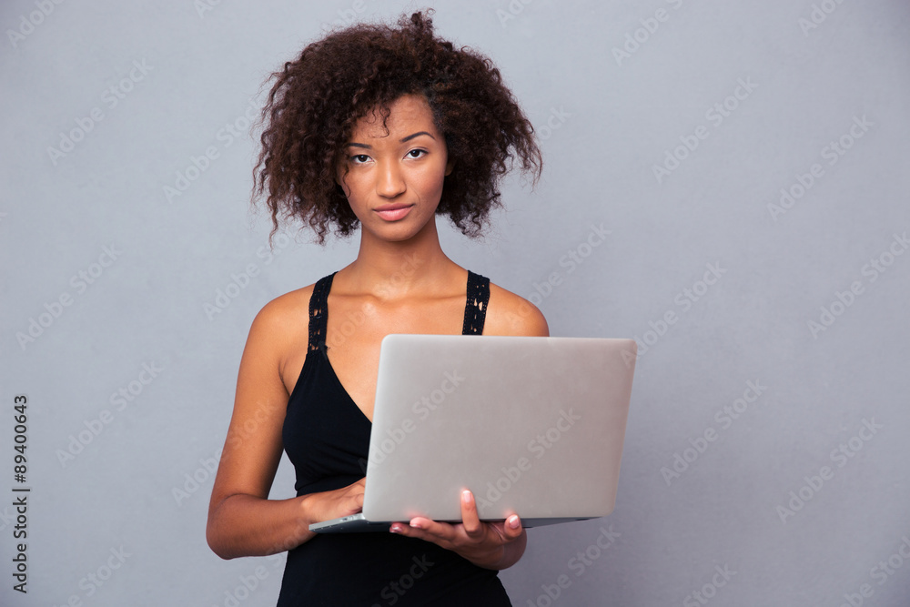 Afro american woman using laptop