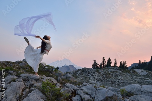A Girl dancing at sunset on Artist Point, Mt. Baker, Washington