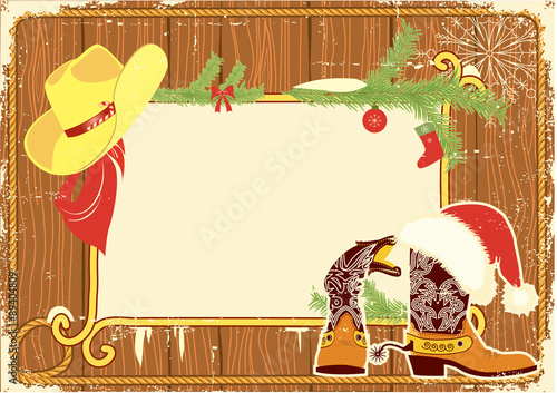 Billboard frame with cowboy boots and Santa's red hat on wood wa