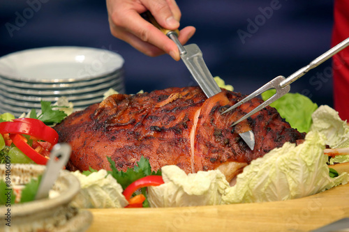 Canvas Print Cook sliced roasted meat at the party