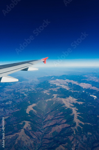 Plane wing with blue sky