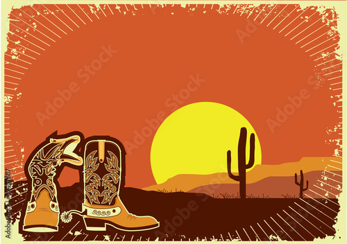 Cowboy boots.Grunge wild western background of sunset