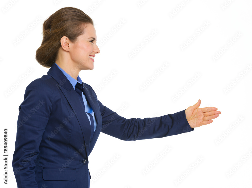 Elegant, smiling business woman in profile going to shake hands Elegant, smiling business woman in profile going to shake hands