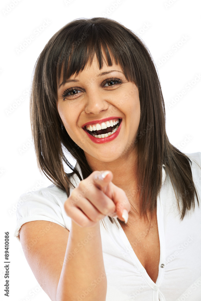 Fototapeta premium Cheerful woman points at camera