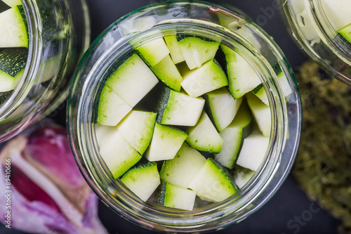 Marinated zucchini pieces in jars