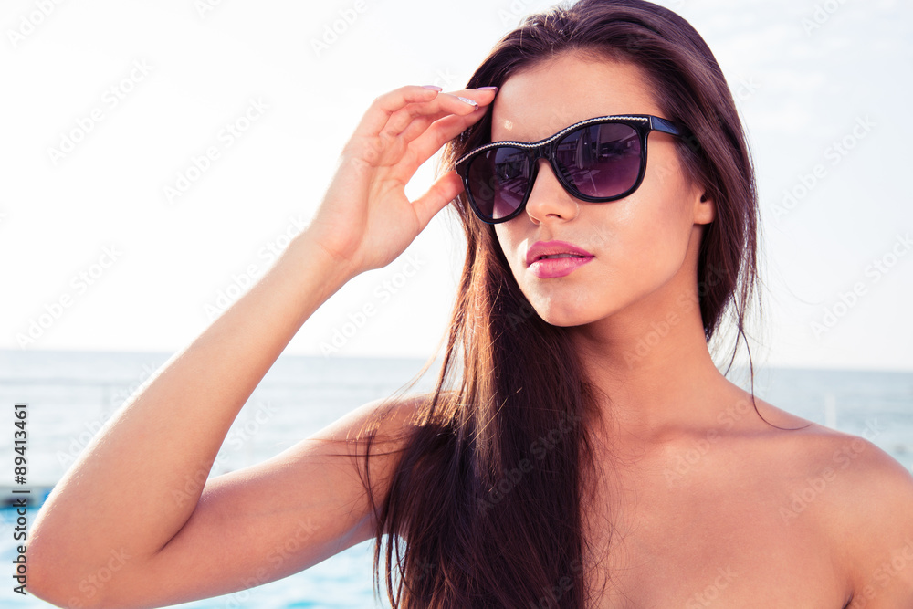 Portrait of a beautiful girl in sunglasses outdoors Portrait of a beautiful girl in sunglasses outdoors