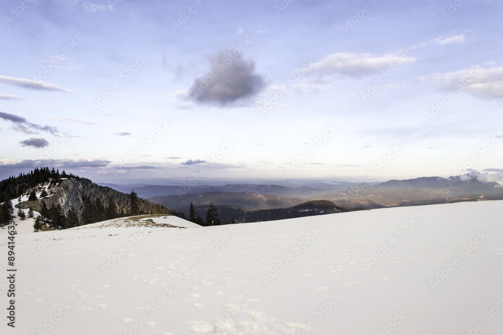 winter mountain landscape with cloudy sky
