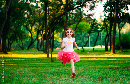  little girl running in the park