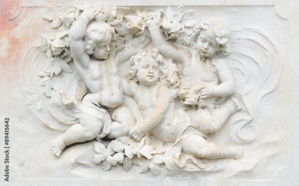 Black and white photography of basrelief with cherubs