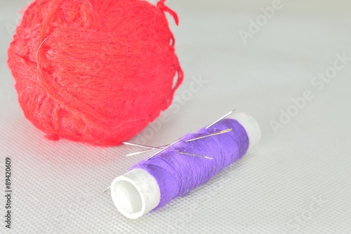 purple yarn and red clew