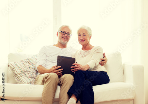 happy senior couple with tablet pc at home © Syda Productions