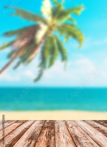 Fototapeta Naklejka Na Ścianę i Meble -  Blurred image of sea sky coconut tree with wooden under