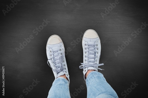 Composite image of woman wearing trainers 