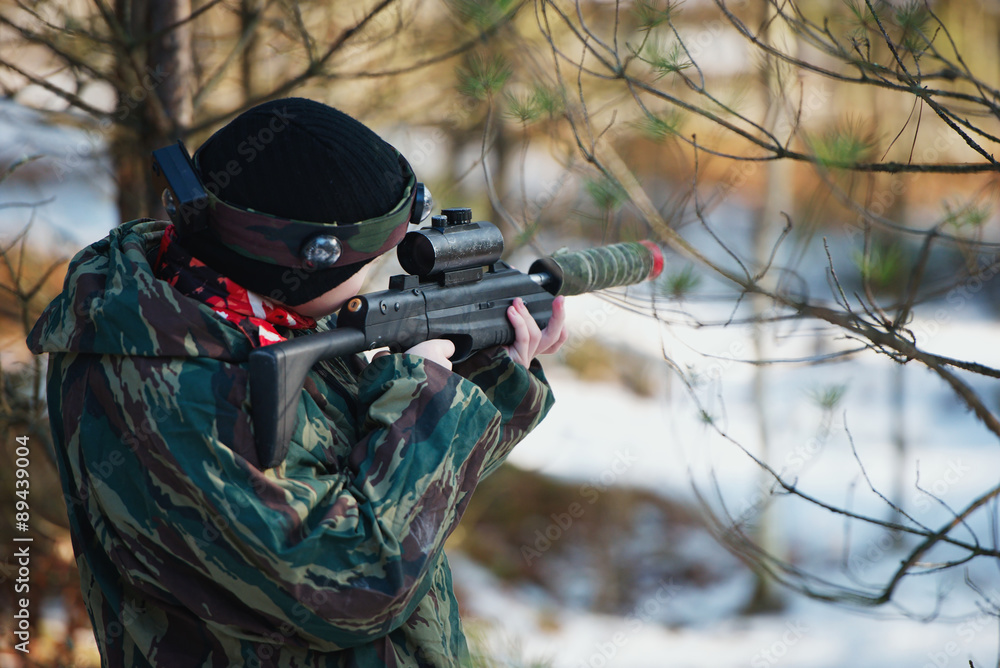 Fototapeta premium boys playing with gun during laser tag