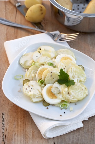 Potato Salad with Sliced Boiled Egg In Wood Bowls