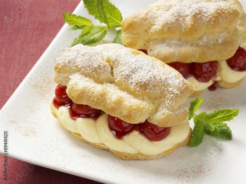 Cream puff filled with vanilla cream and cherries