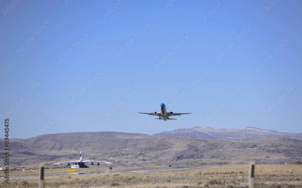 Plane taking off at the airport in San Carlos de Bariloche, Patagonia, Argentina. Plane taking off at the airport in San Carlos de Bariloche, Patagonia, Argentina.