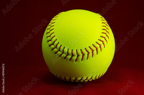 Softball on a red background