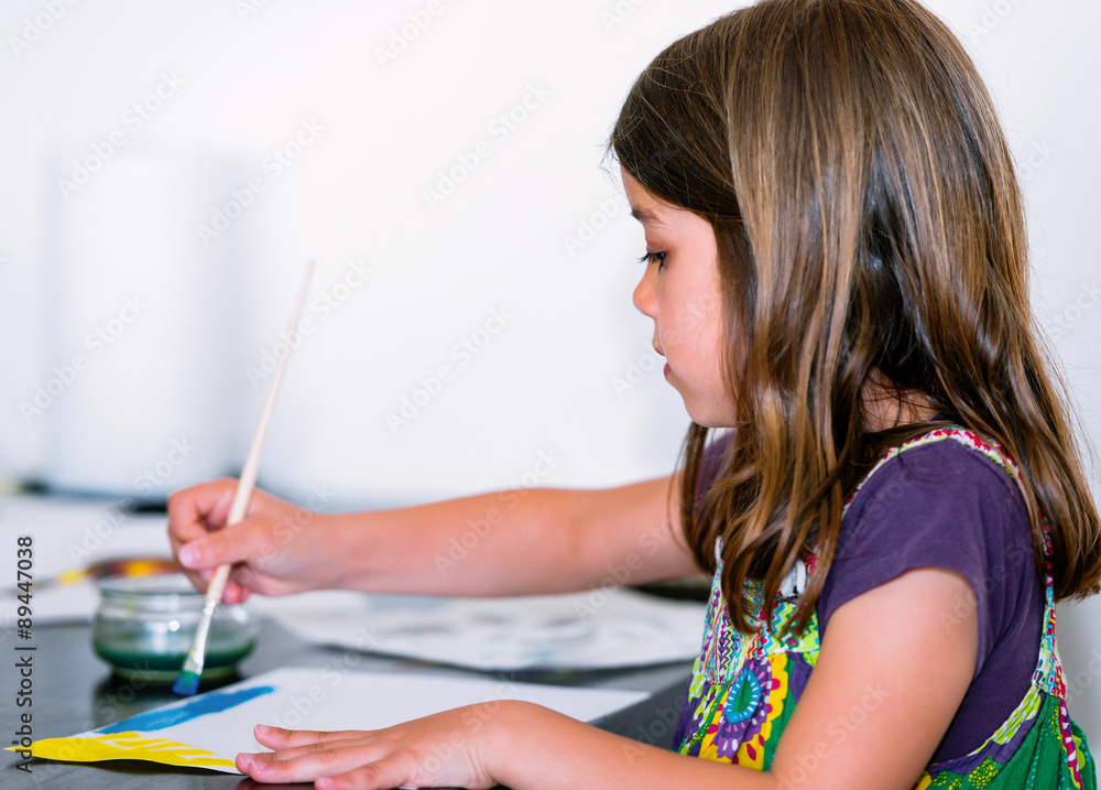 Portrait of pretty girl concentrated while painting Portrait of pretty girl concentrated while painting