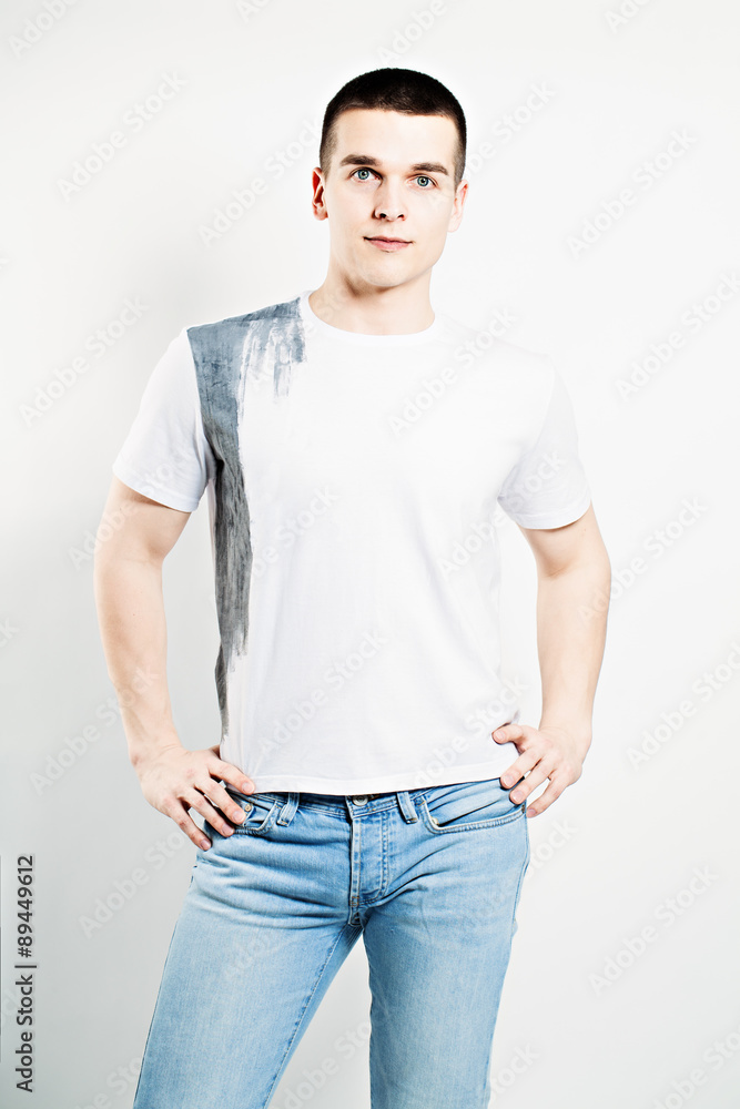 Young Man. White T-shirt and Blue Jeans Young Man. White T-shirt and Blue Jeans