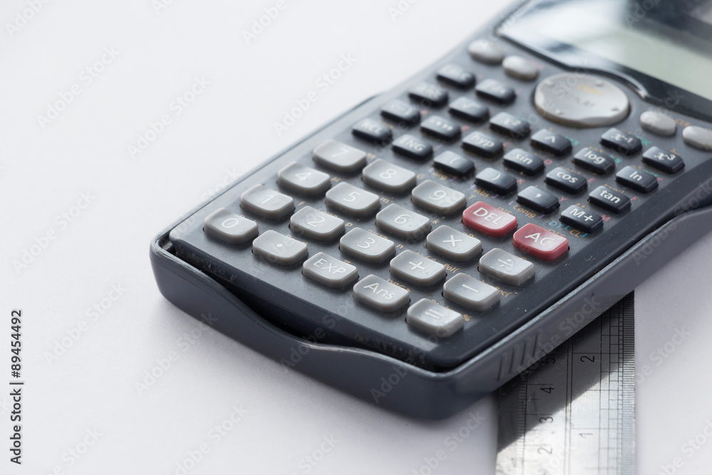 Calculator and Ruler on White Background Calculator and Ruler on White Background