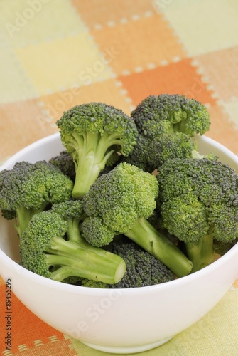 Broccoli florets in white bowl