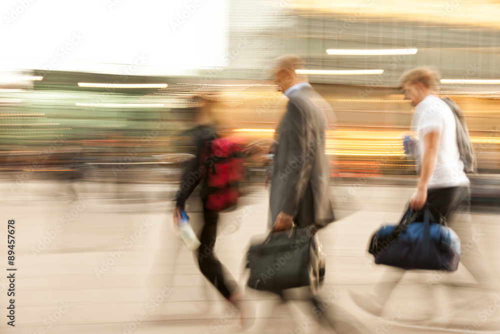 Businesspeople walking past a office building Businesspeople walking past a office building
