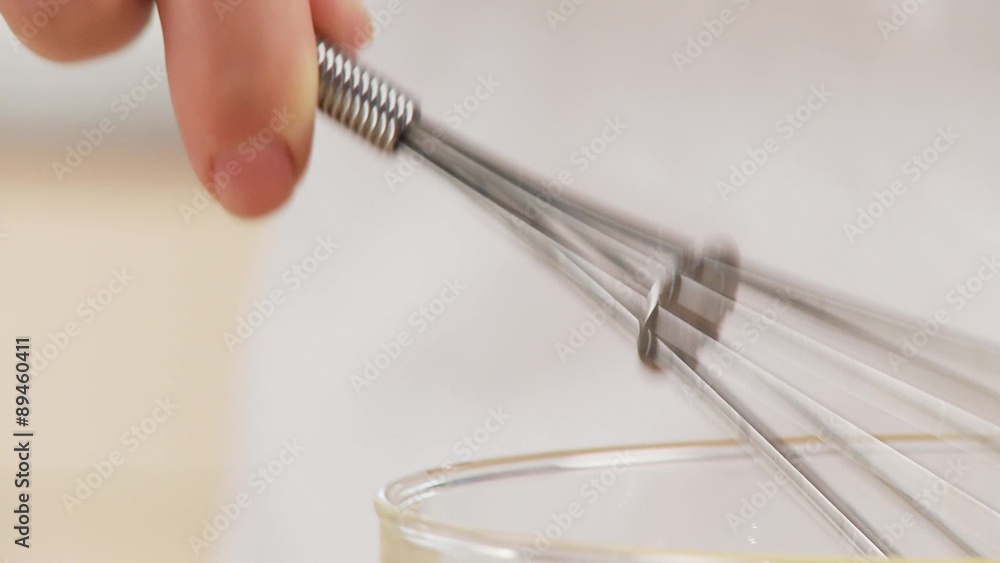 Egg yolk and cream being mixed together Egg yolk and cream being mixed together