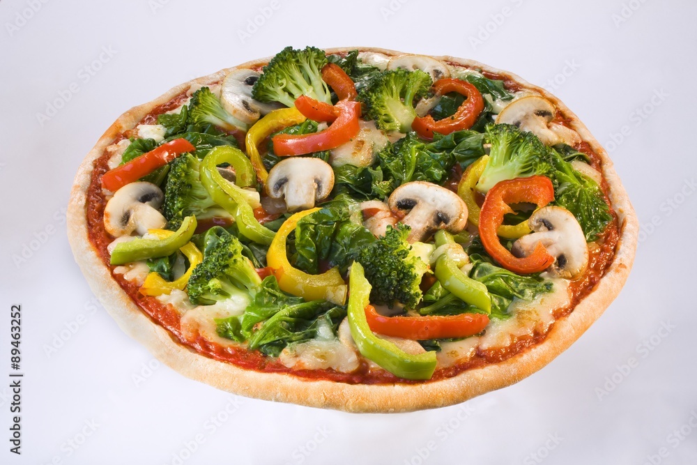 A vegetable pizza with broccoli, pepper and mushrooms A vegetable pizza with broccoli, pepper and mushrooms