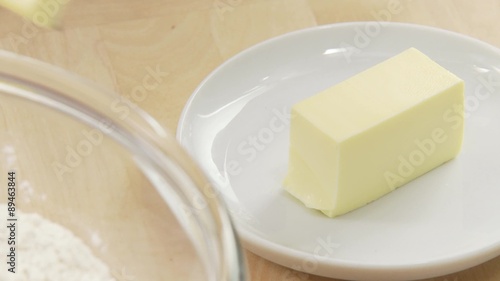 A piece of butter being chopped