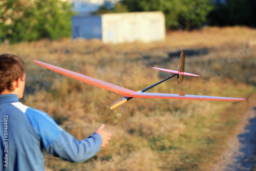 A modelist catches returning model of a glider photo