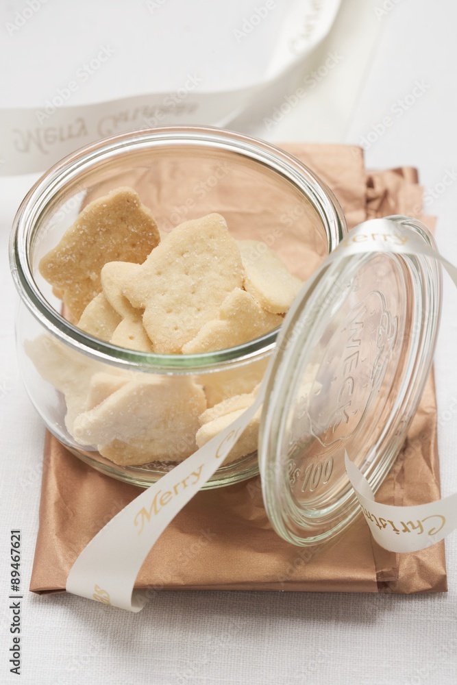Shortbread biscuits in opened storage jar Shortbread biscuits in opened storage jar