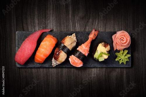 Sushi on black stone plate